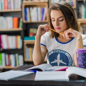 girl-sitting-table-with-notebooks